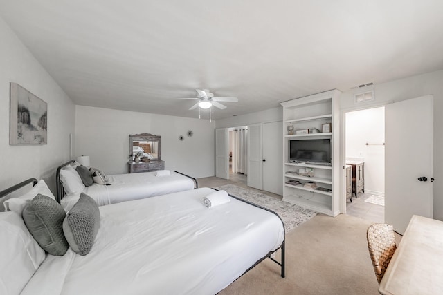 3048 Golfing Green Dr, Farmers Branch, TX 75234 - bedroom with light carpet, a ceiling fan, and connected bathroom