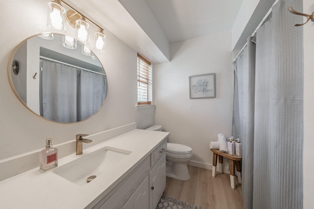 3048 Golfing Green Dr, Farmers Branch, TX 75234 - bathroom with wood finished floors, toilet, vanity, curtained shower, and baseboards