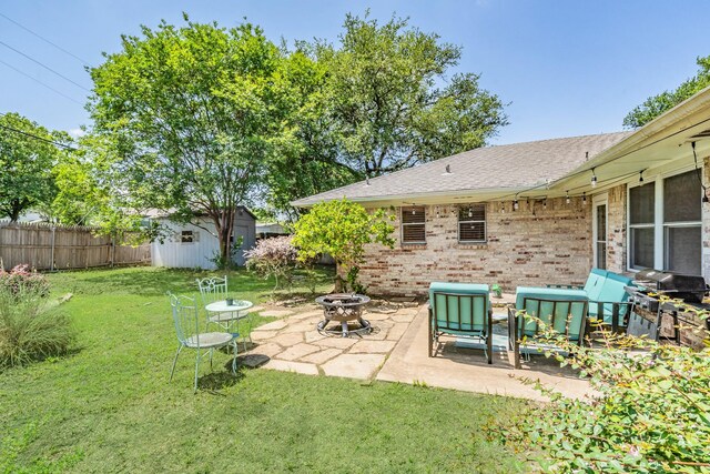 3048 Golfing Green Dr, Farmers Branch, TX 75234 - view of yard featuring a fire pit, a patio, a storage shed, and an outbuilding