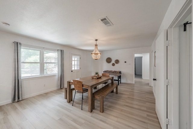3048 Golfing Green Dr, Farmers Branch, TX 75234 - dining space featuring a chandelier, light wood-style floors, and baseboards