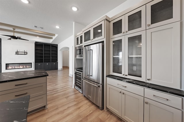 10072 Blanco Springs Rd, Temple, TX 76528 - kitchen featuring stainless steel appliances, wine cooler, a ceiling fan, light wood finished floors, and recessed lighting
