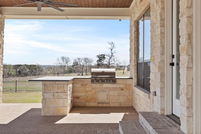 10072 Blanco Springs Rd, Temple, TX 76528 - view of patio / terrace featuring grilling area, an outdoor kitchen, fence, and ceiling fan