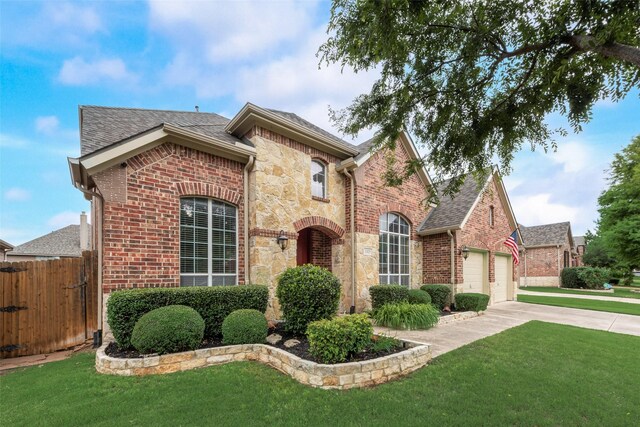 view of front of home featuring driveway, an attached garage, brick siding, roof with shingles, and stone siding