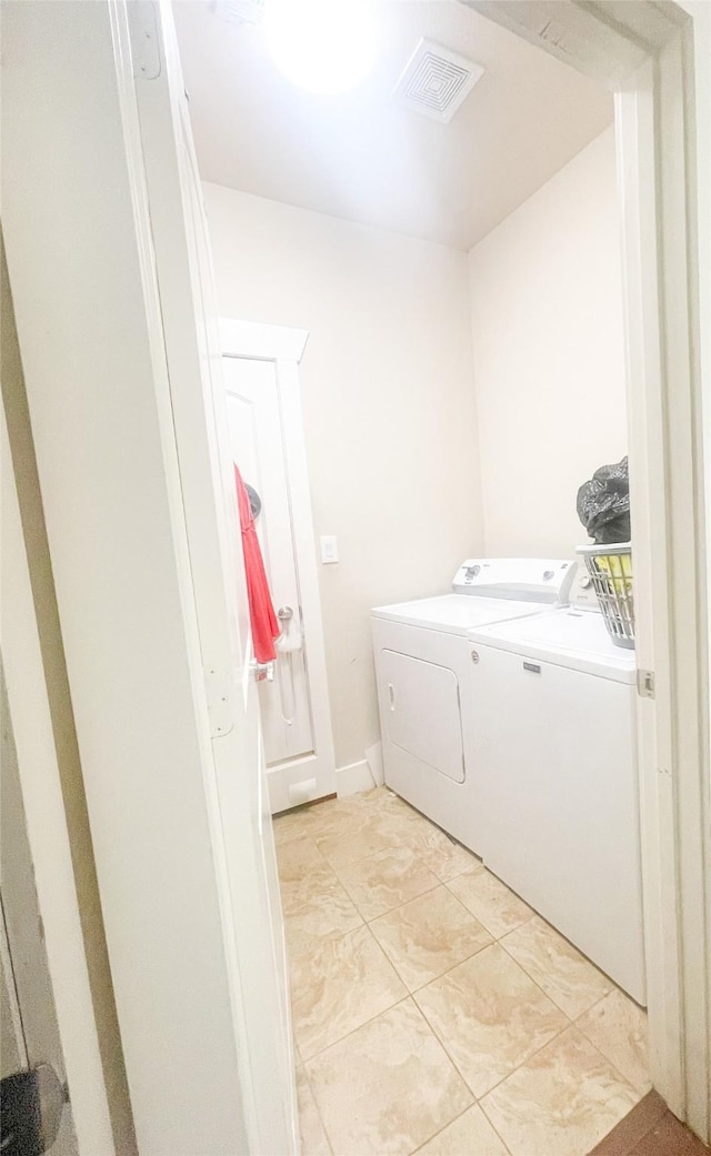 laundry room featuring washing machine and dryer