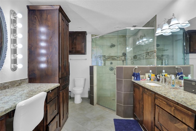 3205 Glasgow Ter, Arlington, TX 76015 - bathroom with a stall shower, tile patterned floors, toilet, vanity, and recessed lighting