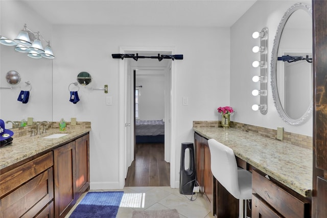 3205 Glasgow Ter, Arlington, TX 76015 - ensuite bathroom with tile patterned flooring, baseboards, and vanity