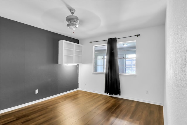 3205 Glasgow Ter, Arlington, TX 76015 - unfurnished room with a ceiling fan, wood finished floors, and baseboards