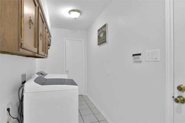 3205 Glasgow Ter, Arlington, TX 76015 - laundry area featuring cabinet space, washer and clothes dryer, light tile patterned floors, and baseboards