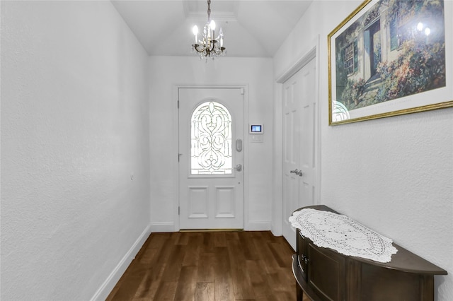 3205 Glasgow Ter, Arlington, TX 76015 - foyer entrance with dark wood finished floors, a chandelier, lofted ceiling, and baseboards