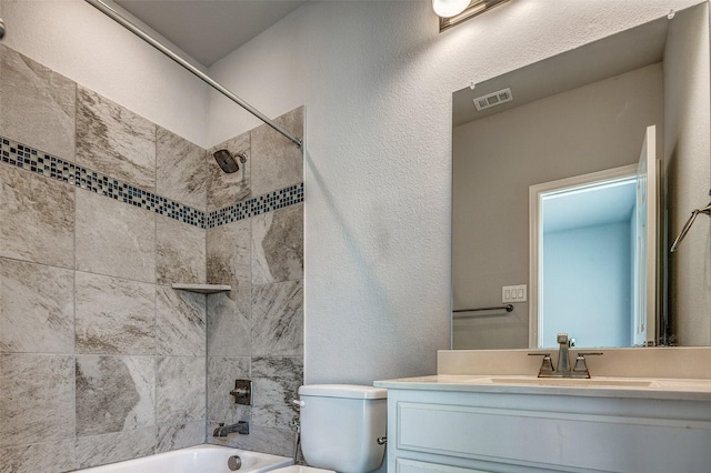 14015 Steadman Dr, Frisco, TX 75035 - full bath with toilet, vanity,  shower combination, and a textured wall