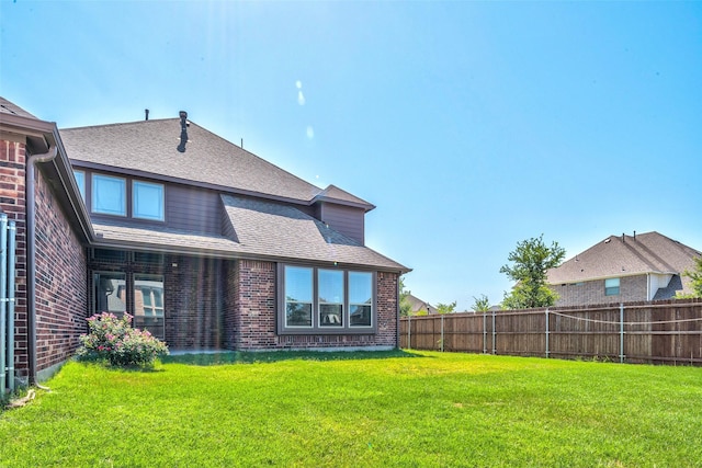 14015 Steadman Dr, Frisco, TX 75035 - rear view of property with brick siding and a shingled roof