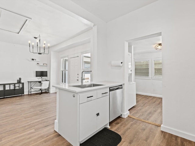 5617 Victor St, Dallas, TX 75214 - kitchen with a sink, dishwasher, light wood finished floors, light countertops, and white cabinets