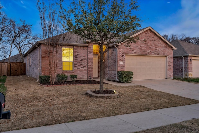 1321 Rivers Creek Ln, Little Elm, TX 75068 - ranch-style home featuring a garage, fence, concrete driveway, and brick siding