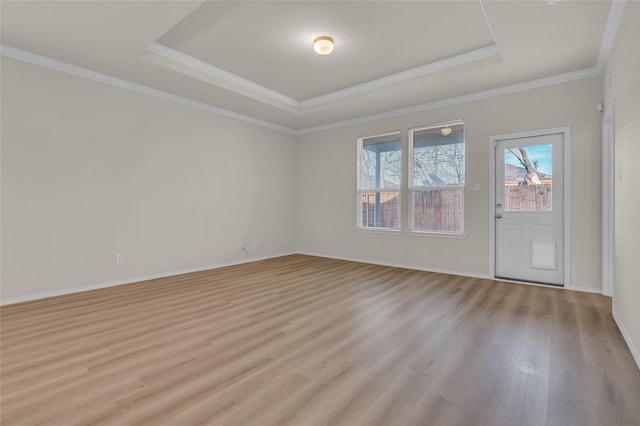 1321 Rivers Creek Ln, Little Elm, TX 75068 - spare room featuring a tray ceiling, light wood finished floors, crown molding, and baseboards