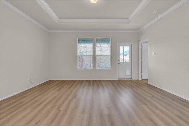 1321 Rivers Creek Ln, Little Elm, TX 75068 - empty room with a raised ceiling, light wood finished floors, crown molding, and baseboards