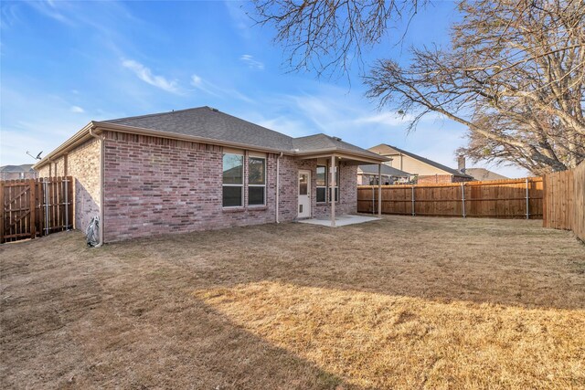 1321 Rivers Creek Ln, Little Elm, TX 75068 - back of house with brick siding, a patio, and roof with shingles