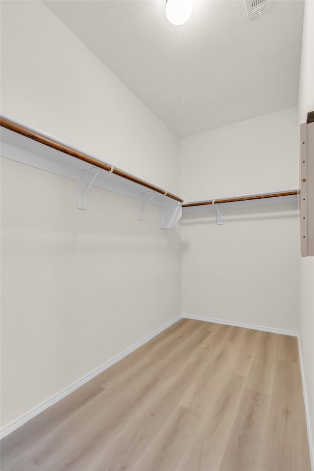 1321 Rivers Creek Ln, Little Elm, TX 75068 - walk in closet featuring light wood-style floors