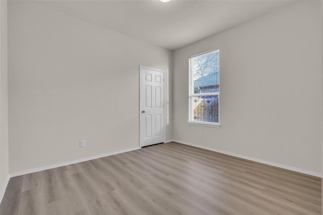 1321 Rivers Creek Ln, Little Elm, TX 75068 - empty room with light wood finished floors and baseboards