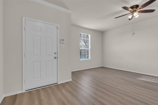 1321 Rivers Creek Ln, Little Elm, TX 75068 - foyer entrance featuring wood finished floors, a ceiling fan, and baseboards