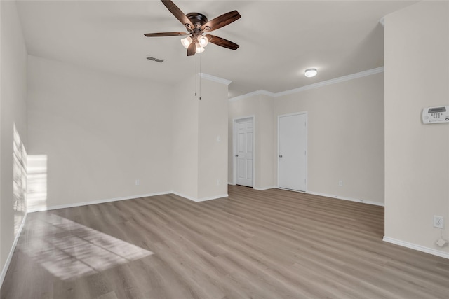 1321 Rivers Creek Ln, Little Elm, TX 75068 - unfurnished living room featuring a ceiling fan, wood finished floors, crown molding, and baseboards
