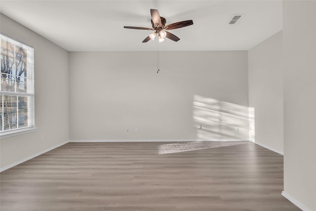 1321 Rivers Creek Ln, Little Elm, TX 75068 - spare room featuring wood finished floors, plenty of natural light, ceiling fan, and baseboards