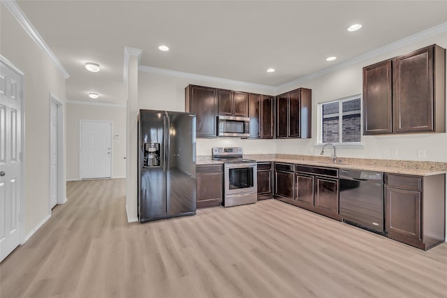 1321 Rivers Creek Ln, Little Elm, TX 75068 - kitchen featuring black appliances, dark brown cabinets, light wood-style flooring, a sink, and crown molding