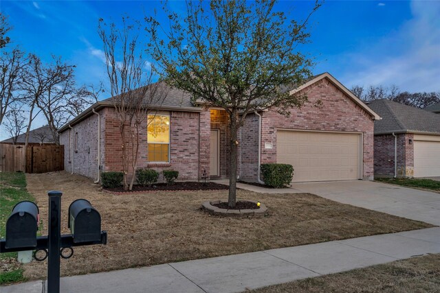 1321 Rivers Creek Ln, Little Elm, TX 75068 - ranch-style home with an attached garage, fence, driveway, and brick siding