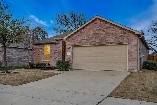 1321 Rivers Creek Ln, Little Elm, TX 75068 - single story home featuring an attached garage, driveway, and brick siding