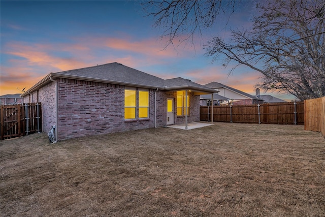 1321 Rivers Creek Ln, Little Elm, TX 75068 - back of property featuring brick siding, a shingled roof, and a patio area