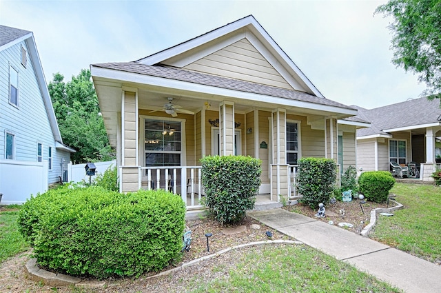 9912 Concord Dr, Providence Village, TX 76227 - view of front facade with covered porch, a ceiling fan, and roof with shingles