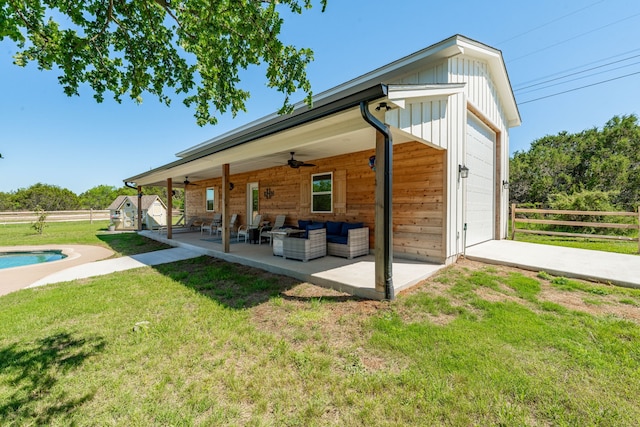 11775 Wind Hollow Ct, Tolar, TX 76476 - back of house with ceiling fan, outdoor lounge area, board and batten siding, a patio, and a garage