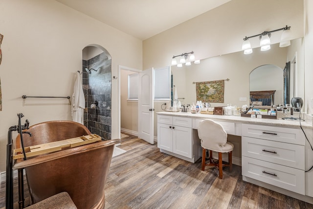 11775 Wind Hollow Ct, Tolar, TX 76476 - bathroom featuring wood finished floors, vanity, a tile shower, and a soaking tub