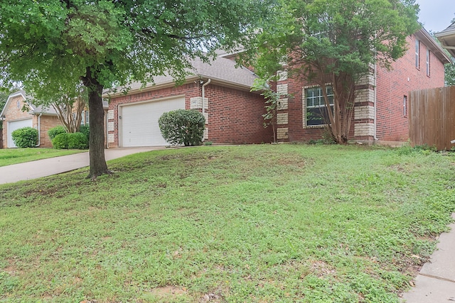 6913 Mccracken Ct, Fort Worth, TX 76132 - view of property hidden behind natural elements with brick siding, an attached garage, and driveway