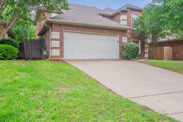 6913 Mccracken Ct, Fort Worth, TX 76132 - view of front of home featuring brick siding, a garage, driveway, and roof with shingles
