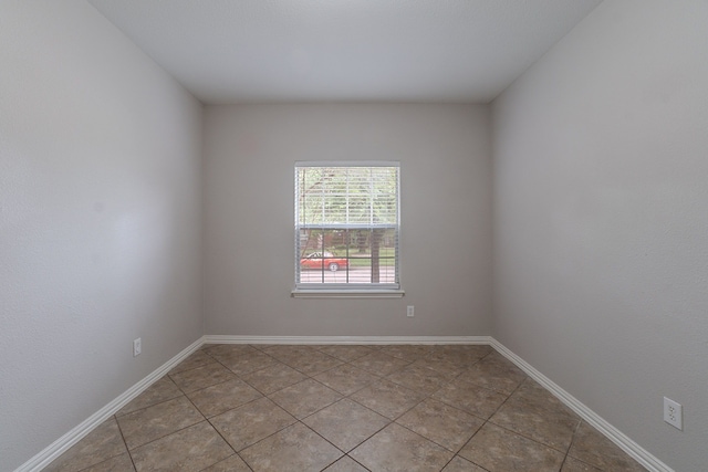 6913 Mccracken Ct, Fort Worth, TX 76132 - unfurnished room with light tile patterned floors and baseboards