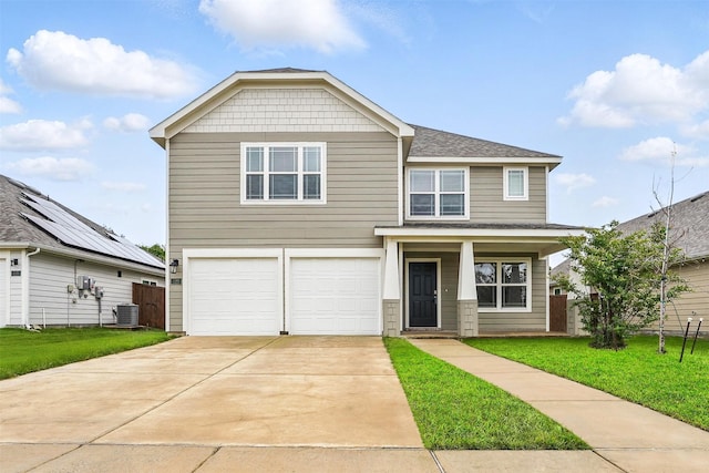 123 Rock Creek Ln, Terrell, TX 75160 - view of front of home featuring central air condition unit, an attached garage, driveway, a shingled roof, and covered porch