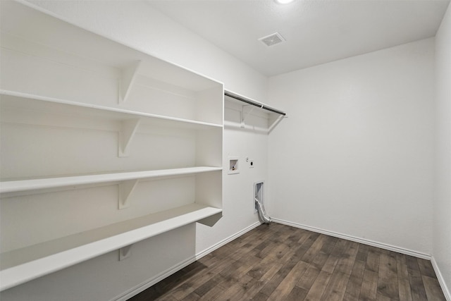 123 Rock Creek Ln, Terrell, TX 75160 - washroom with hookup for an electric dryer, hookup for a washing machine, dark wood finished floors, baseboards, and gas dryer hookup
