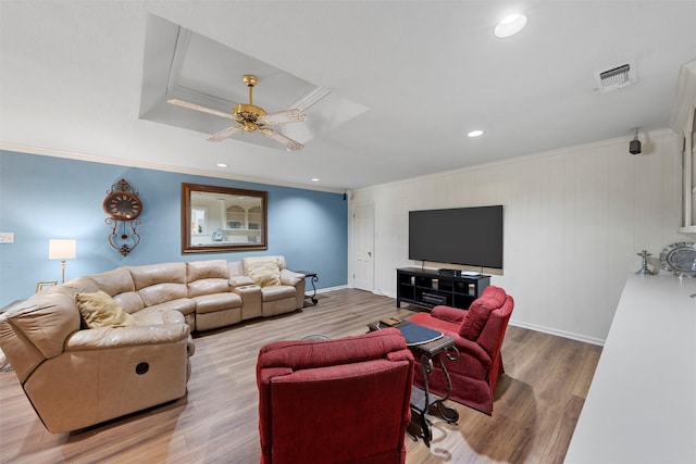 living room with ornamental molding, wood finished floors, ceiling fan, recessed lighting, and baseboards