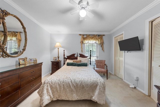 bedroom with light colored carpet, ornamental molding, baseboards, and ceiling fan