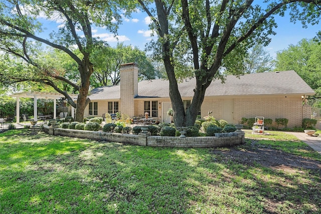 rear view of house featuring a patio area, brick siding, a chimney, a pergola, and a lawn