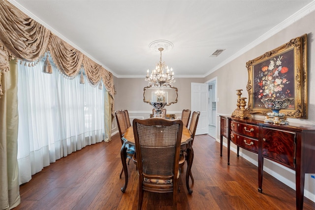 dining space featuring a chandelier, crown molding, and dark wood-style floors