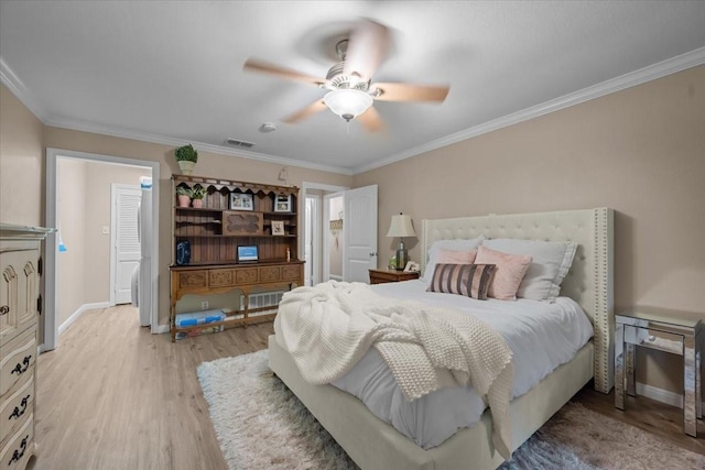 5036 Lake Shore Dr, Waco, TX 76710 - bedroom featuring light wood-type flooring, ornamental molding, baseboards, and a ceiling fan