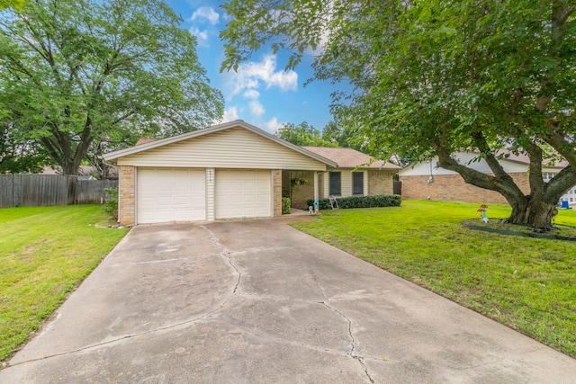 ranch-style home featuring brick siding, driveway, and a garage