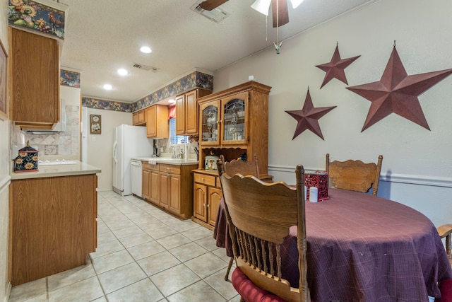 dining area featuring a textured ceiling, a ceiling fan, light tile patterned flooring, and recessed lighting