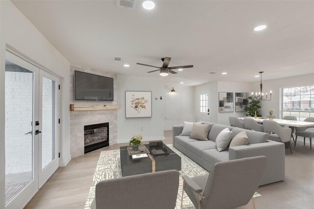 7319 Rutgers Dr, Dallas, TX 75214 - living area featuring plenty of natural light, a fireplace, recessed lighting, ceiling fan, and a chandelier