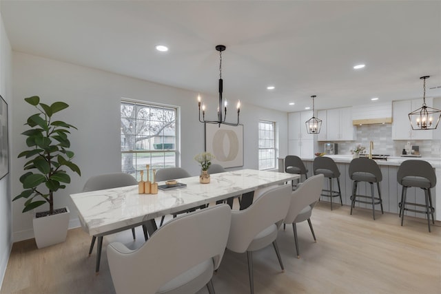 7319 Rutgers Dr, Dallas, TX 75214 - dining space with light wood-style floors, a chandelier, recessed lighting, and baseboards