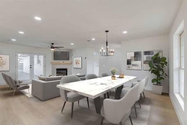 7319 Rutgers Dr, Dallas, TX 75214 - dining space featuring light wood-style flooring, a fireplace, recessed lighting, a ceiling fan, and baseboards