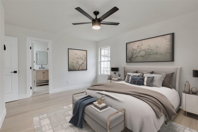 7319 Rutgers Dr, Dallas, TX 75214 - bedroom featuring light wood-style flooring, baseboards, connected bathroom, and ceiling fan