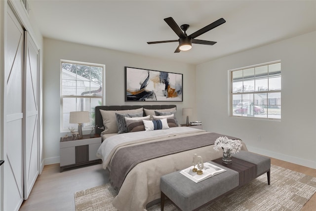 7319 Rutgers Dr, Dallas, TX 75214 - bedroom featuring light wood-style floors, baseboards, and ceiling fan