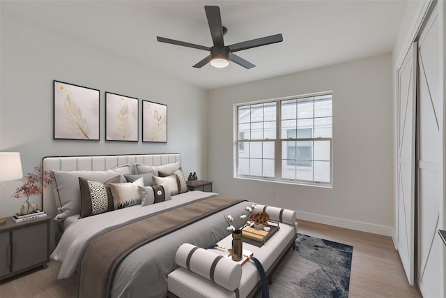 7319 Rutgers Dr, Dallas, TX 75214 - bedroom with baseboards, light wood-type flooring, a closet, and ceiling fan